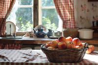 Basket of peaches in a kitchen