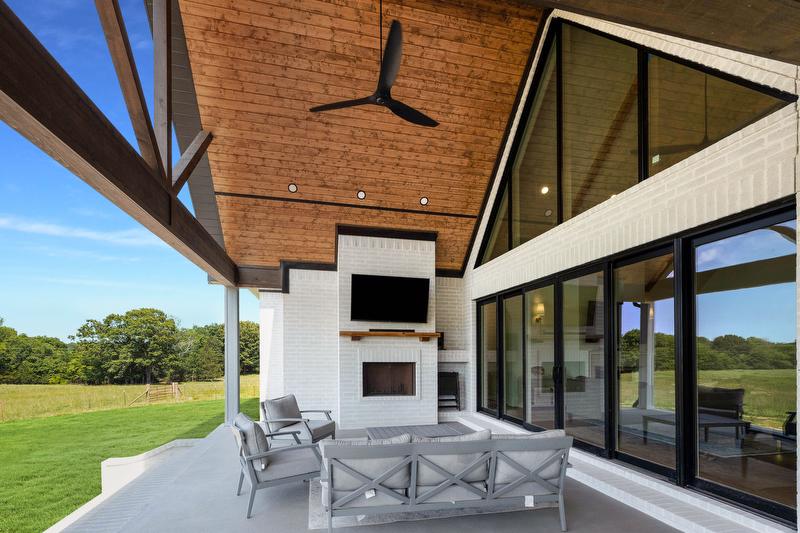  The outdoor kitchen and patio were designed for fellowship, family meals and evenings spent overlooking the pasture. 