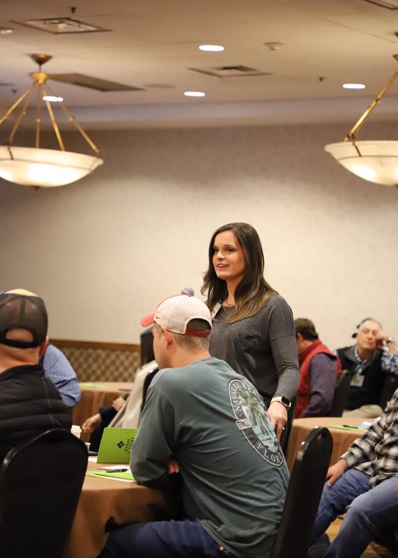 Woman speaking in front of crowd