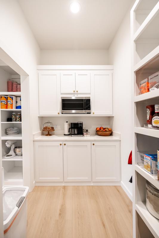Greene family pantry space with additional storage and food prep space