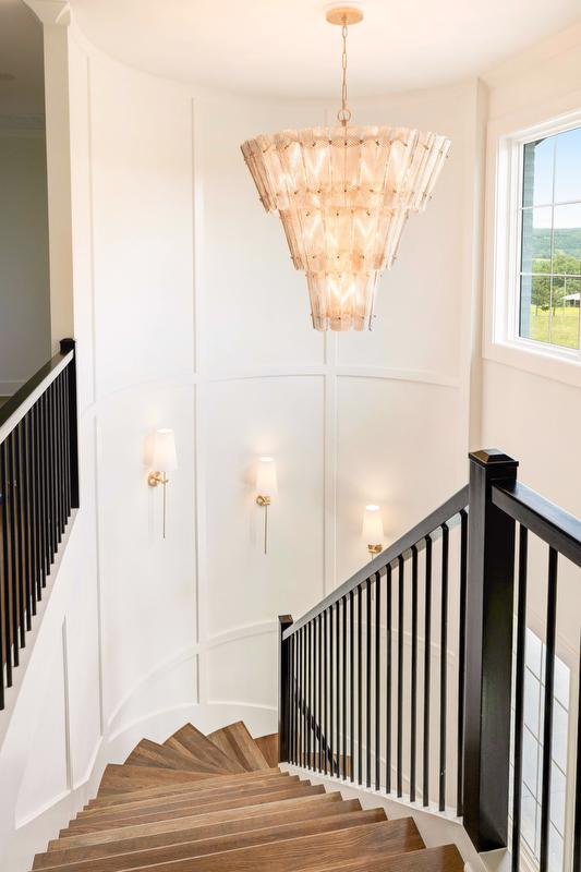 Staircase with modern chandelier