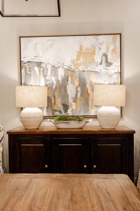 Talley family home credenza, lamps, and artwork area