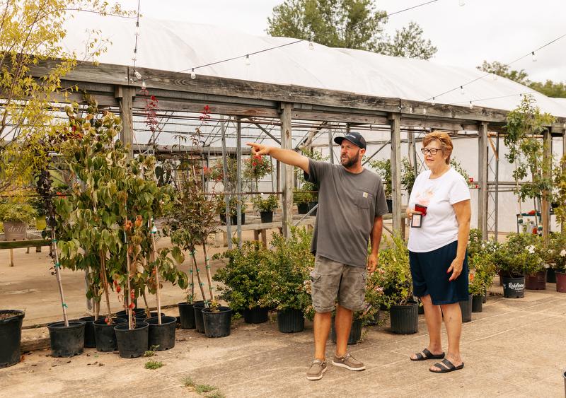Andrew Witt helps point a customer in the right direction at Blossomberry Nursery