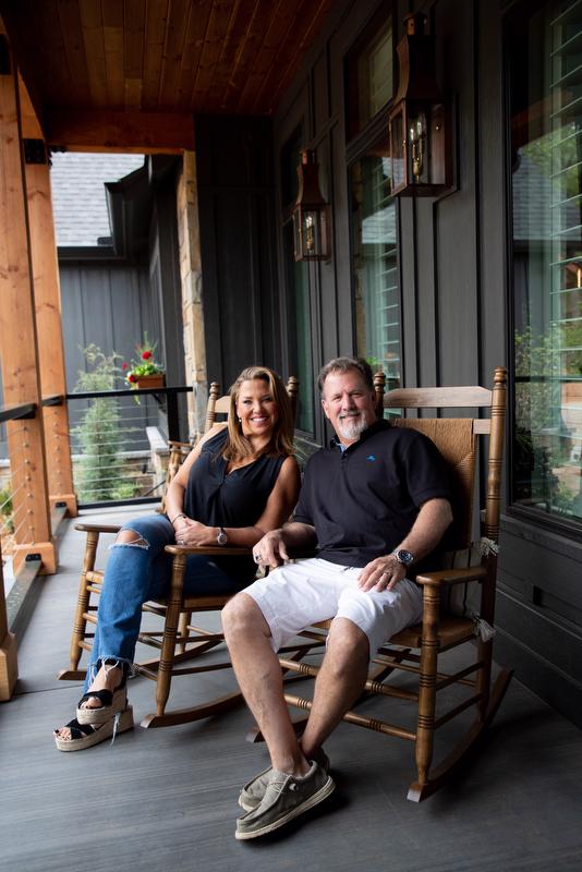 Chad and Keri Blevins sit on their front porch.