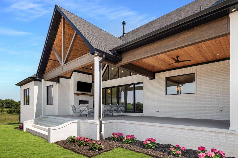 Large back porch with outdoor kitchen rural living