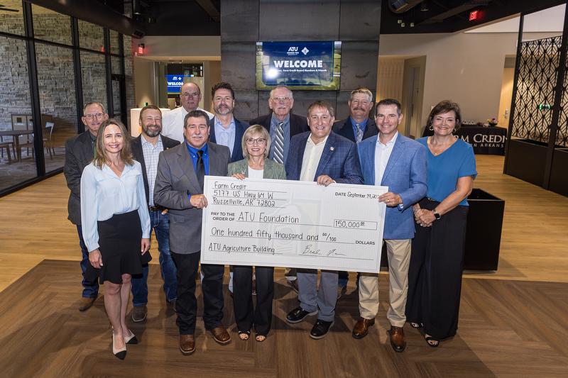 Farm Credit of Western Arkansas board members present the donation check to Arkansas Tech University President Dr. Russell Jones.