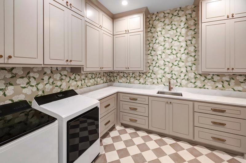 A hydrangea-print wallpaper transforms the laundry room into one of the home’s most memorable spaces. 