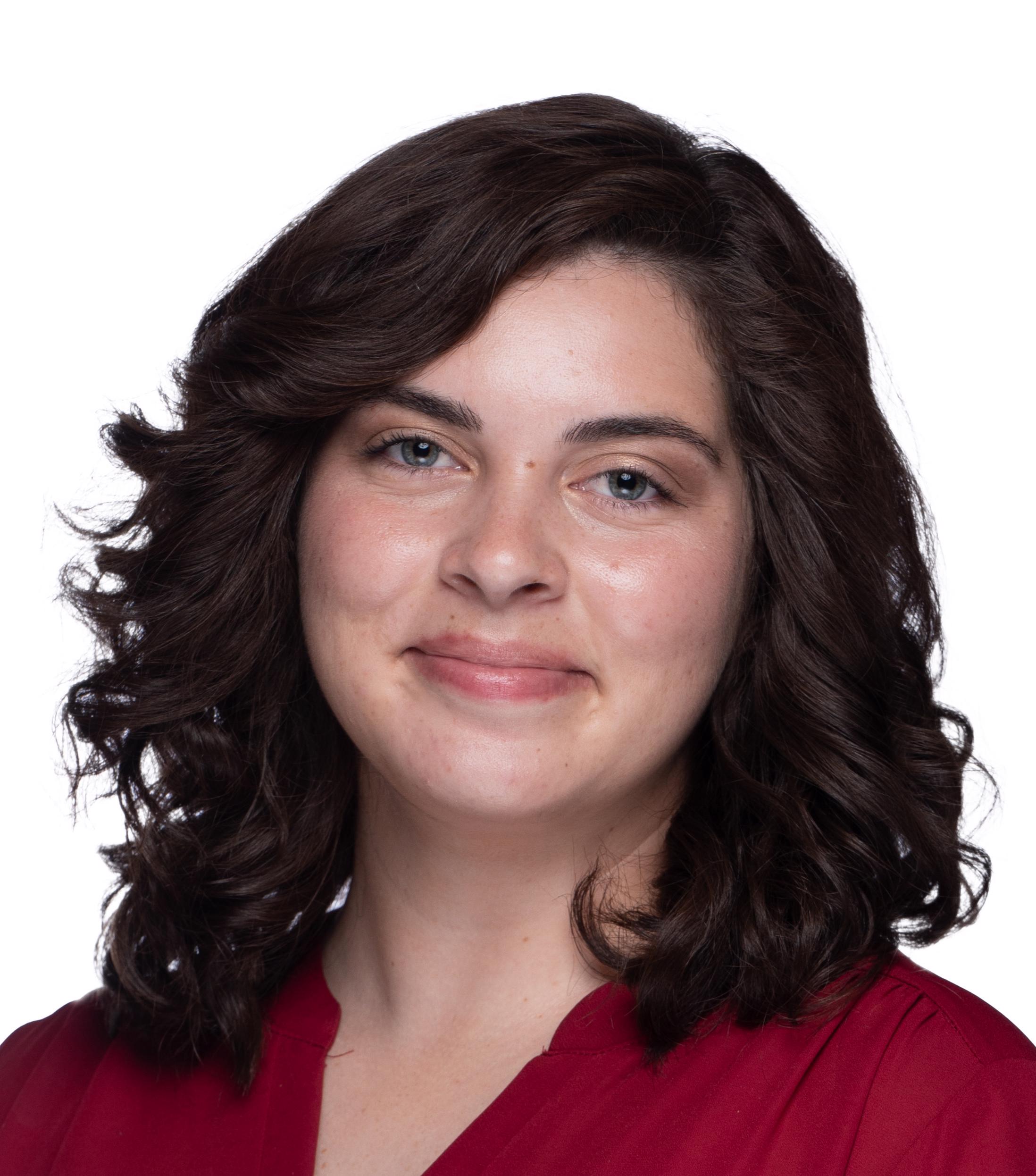 Woman with brown hair and red shirt