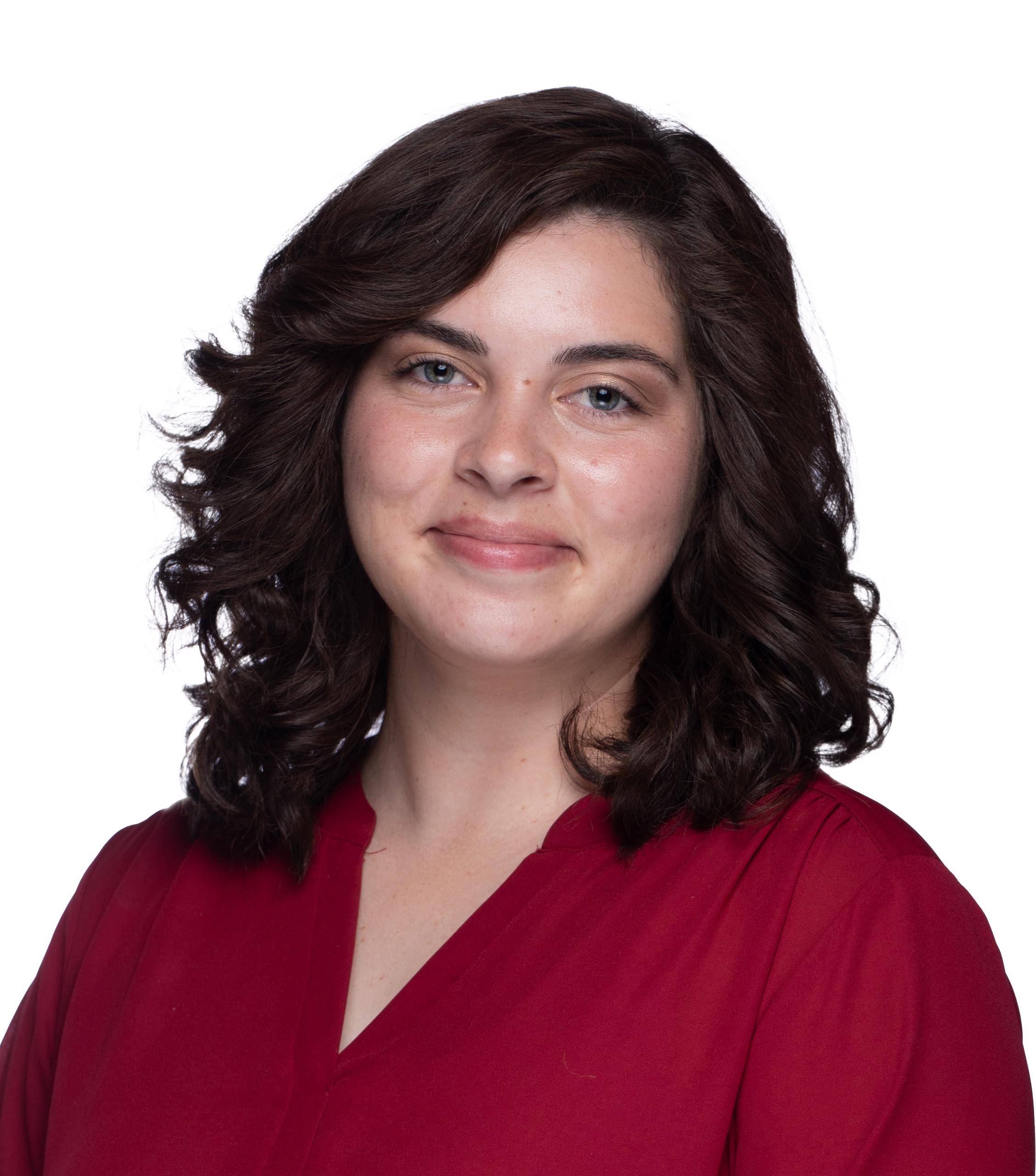 Woman with brown hair and red shirt