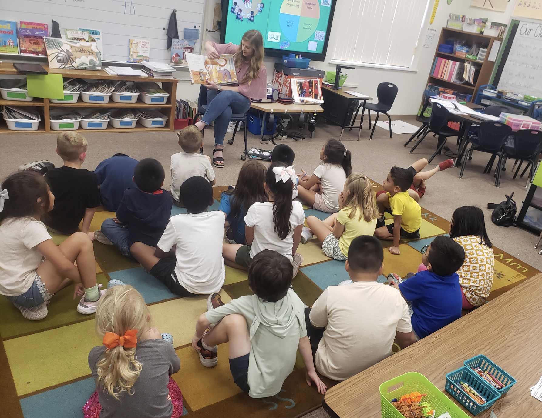 Taylor Plugge, consumer loan officer in Clarksville, donated $500 to Clarksville Rotary Club through our Community Involvement Program. Over the past year, Taylor has played an active role in her organization. Pictured is Taylor participating in the Rotary Readers Program where she read once a week to the local primary and elementary school to promote the importance of literacy and reading at a young age.